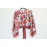 White wrap blouse with colorful pattern