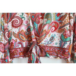 White wrap blouse with colorful pattern